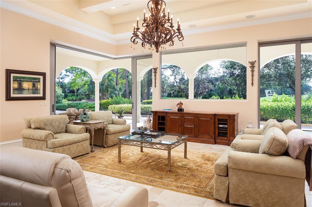 219 Cheshire Way Naples, FL 34110 - Photo 19 of 46 a living room with furniture and a large window