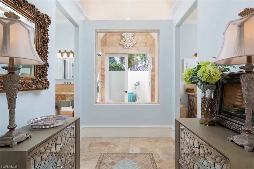 219 Cheshire Way Naples, FL 34110 - Photo 21 of 46 a view of hall way with furniture and a window