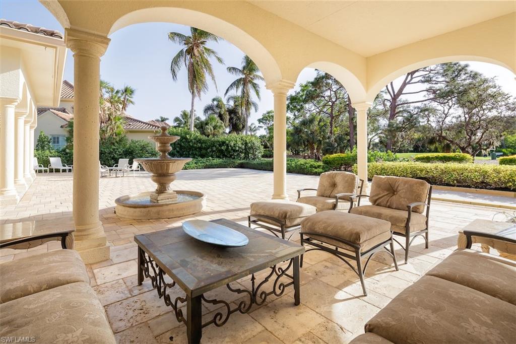 219 Cheshire Way Naples, FL 34110 - Photo 32 of 46 a view of a patio with couches table and chairs