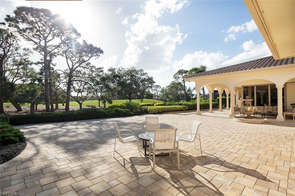 219 Cheshire Way Naples, FL 34110 - Photo 34 of 46 a view of a house with backyard and sitting area