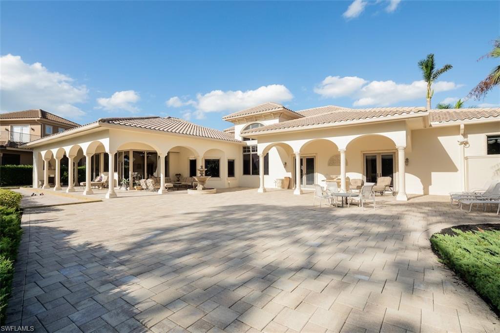 219 Cheshire Way Naples, FL 34110 - Photo 36 of 46 a view of a white house with a yard