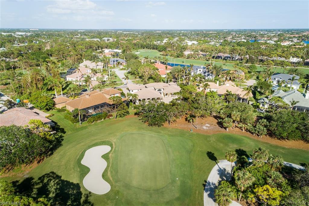 219 Cheshire Way Naples, FL 34110 - Photo 42 of 46 an aerial view of residential houses with outdoor space