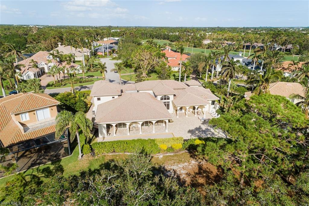 219 Cheshire Way Naples, FL 34110 - Photo 44 of 46 an aerial view of a house with a garden