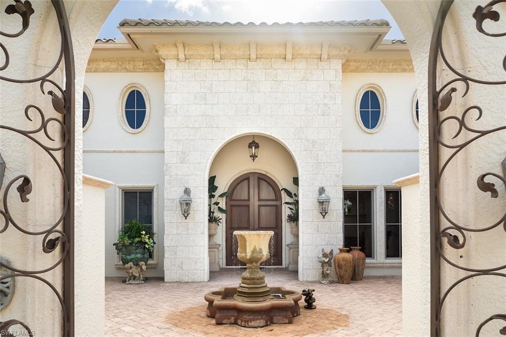 219 Cheshire Way Naples, FL 34110 - Photo 7 of 46 a living room with furniture and a mirror