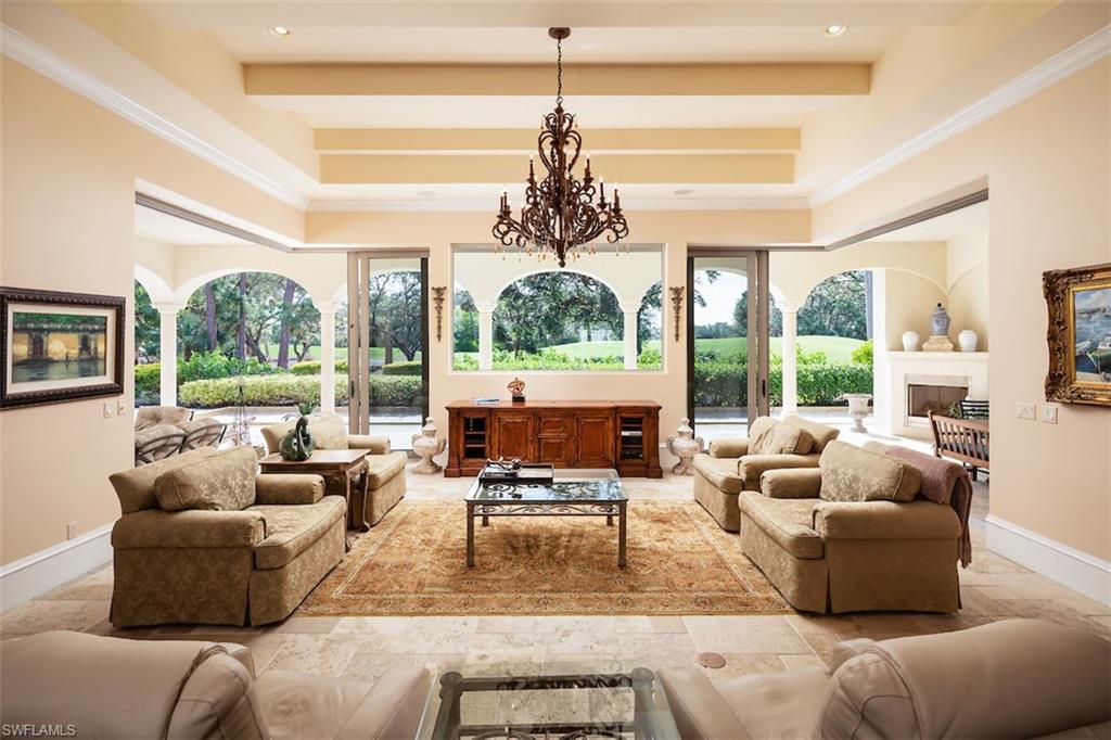 219 Cheshire Way Naples, FL 34110 - Photo 8 of 46 a living room with furniture and a large window