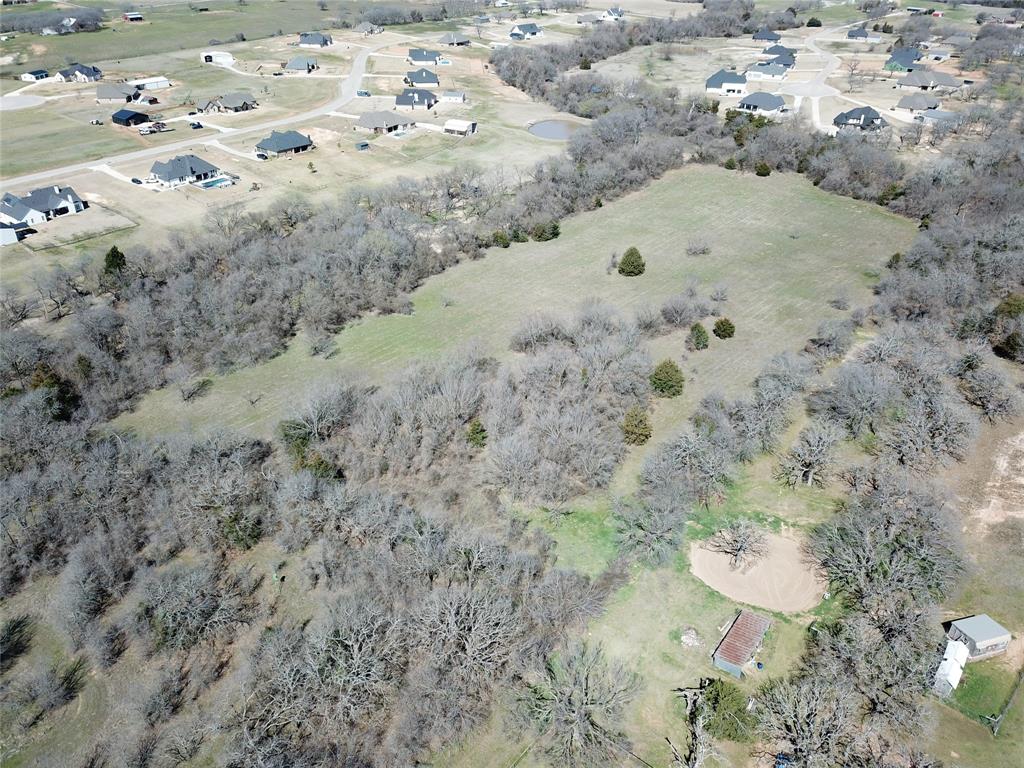 941 County Road 4270 Decatur, TX 76234 - Photo 18 of 19 a view of a dry yard with trees