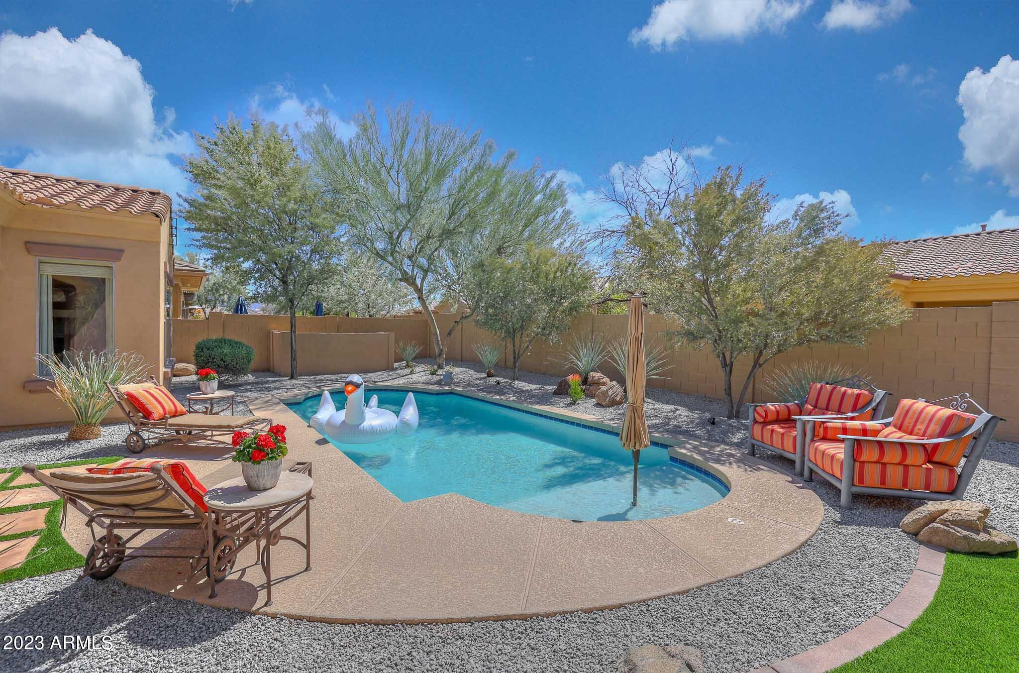 18047 West Narramore Road Goodyear, AZ 85338 - Photo 2 of 98 Relaxing backyard with Pool