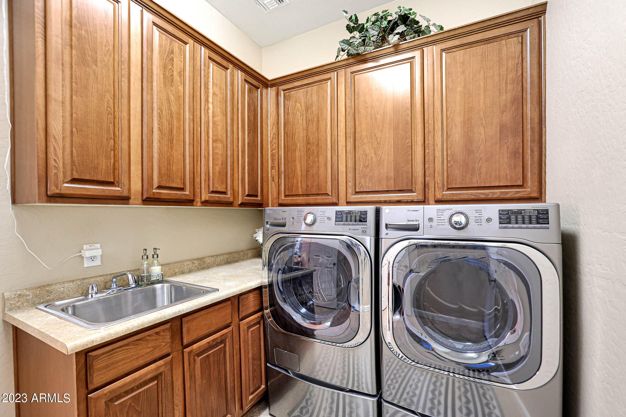18047 West Narramore Road Goodyear, AZ 85338 - Photo 39 of 98 Laundry with upgraded cabinets