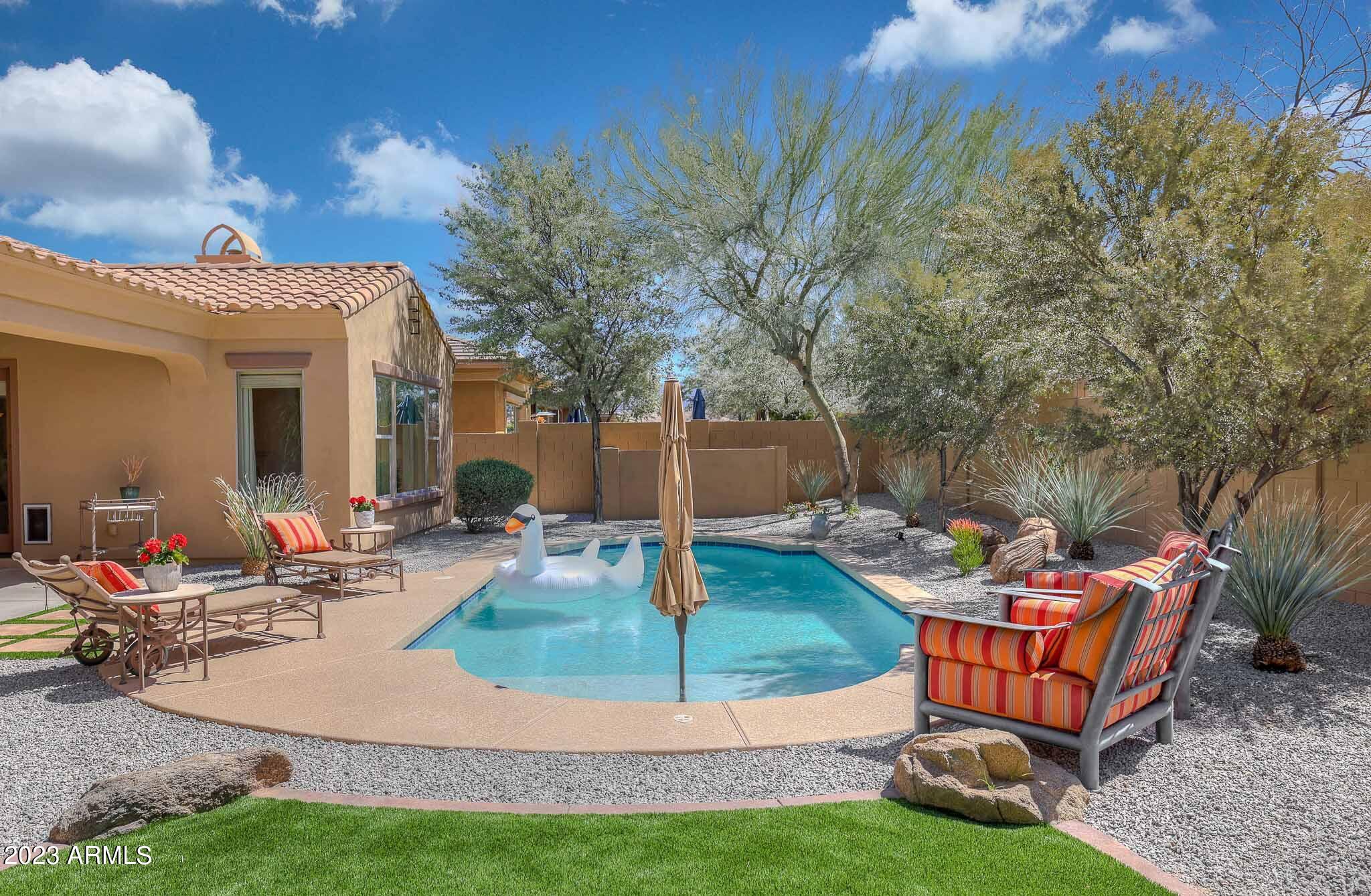18047 West Narramore Road Goodyear, AZ 85338 - Photo 62 of 98 Decking surrounding the pool