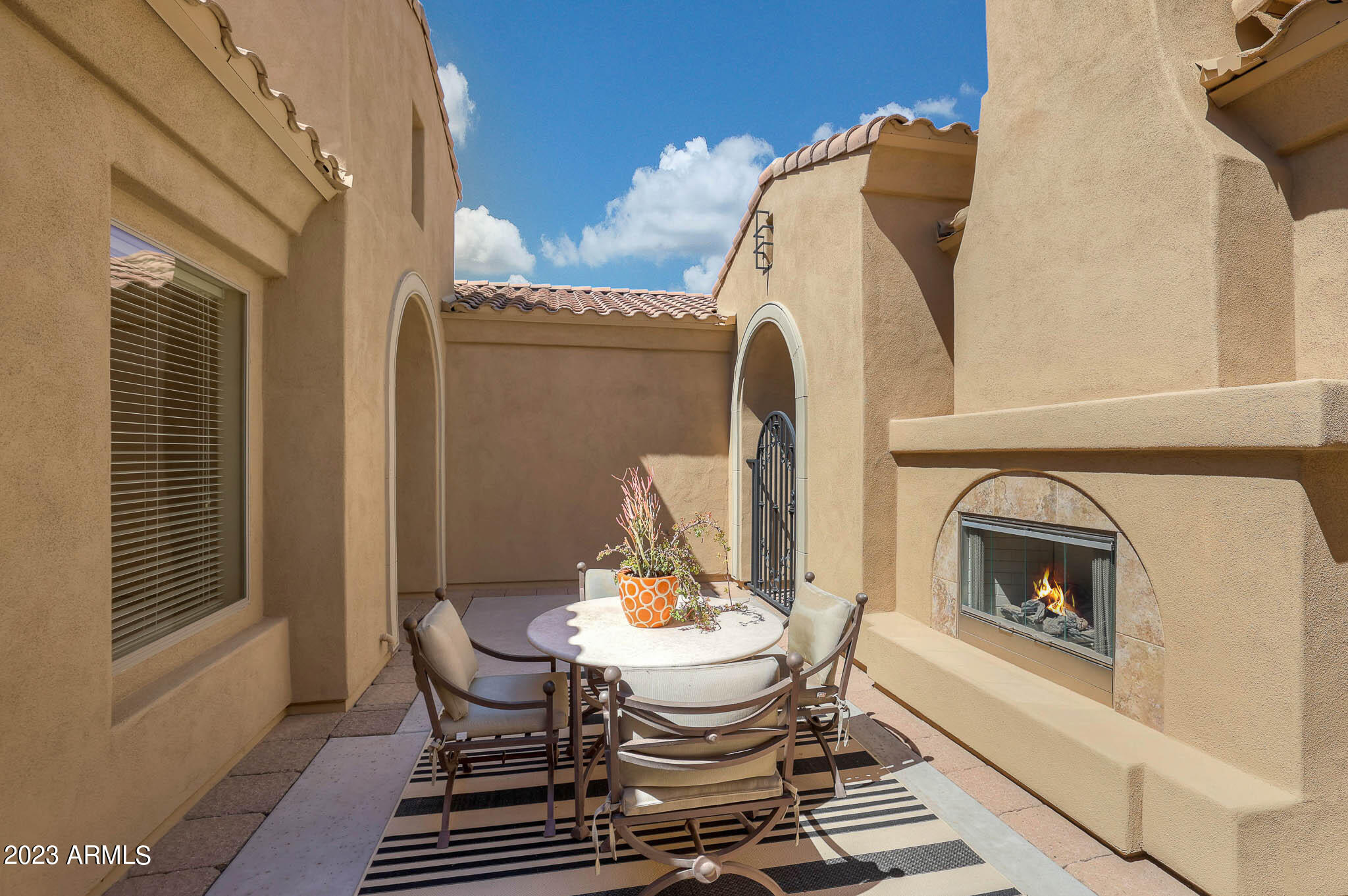18047 West Narramore Road Goodyear, AZ 85338 - Photo 7 of 98 Courtyard with Fireplace
