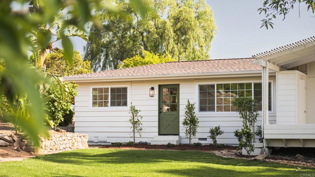 1520 Via Rancho Parkway Escondido, CA 92029 - Photo 82 of 89 a front view of a house with a yard garage and outdoor seating