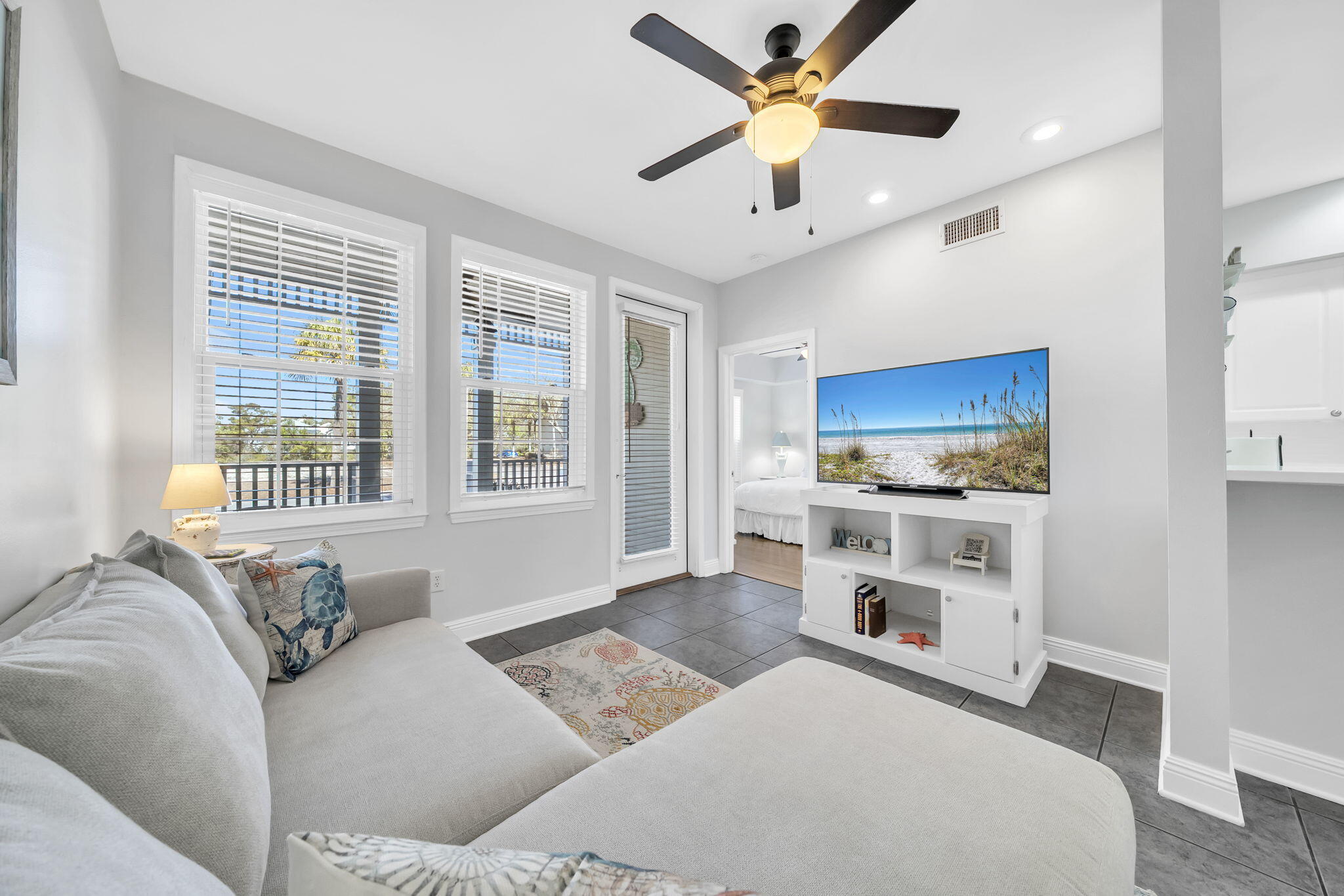 86 Village Boulevard, Unit 411 Santa Rosa Beach, FL 32459 - Photo 1 of 42 a living room with furniture and a flat screen tv