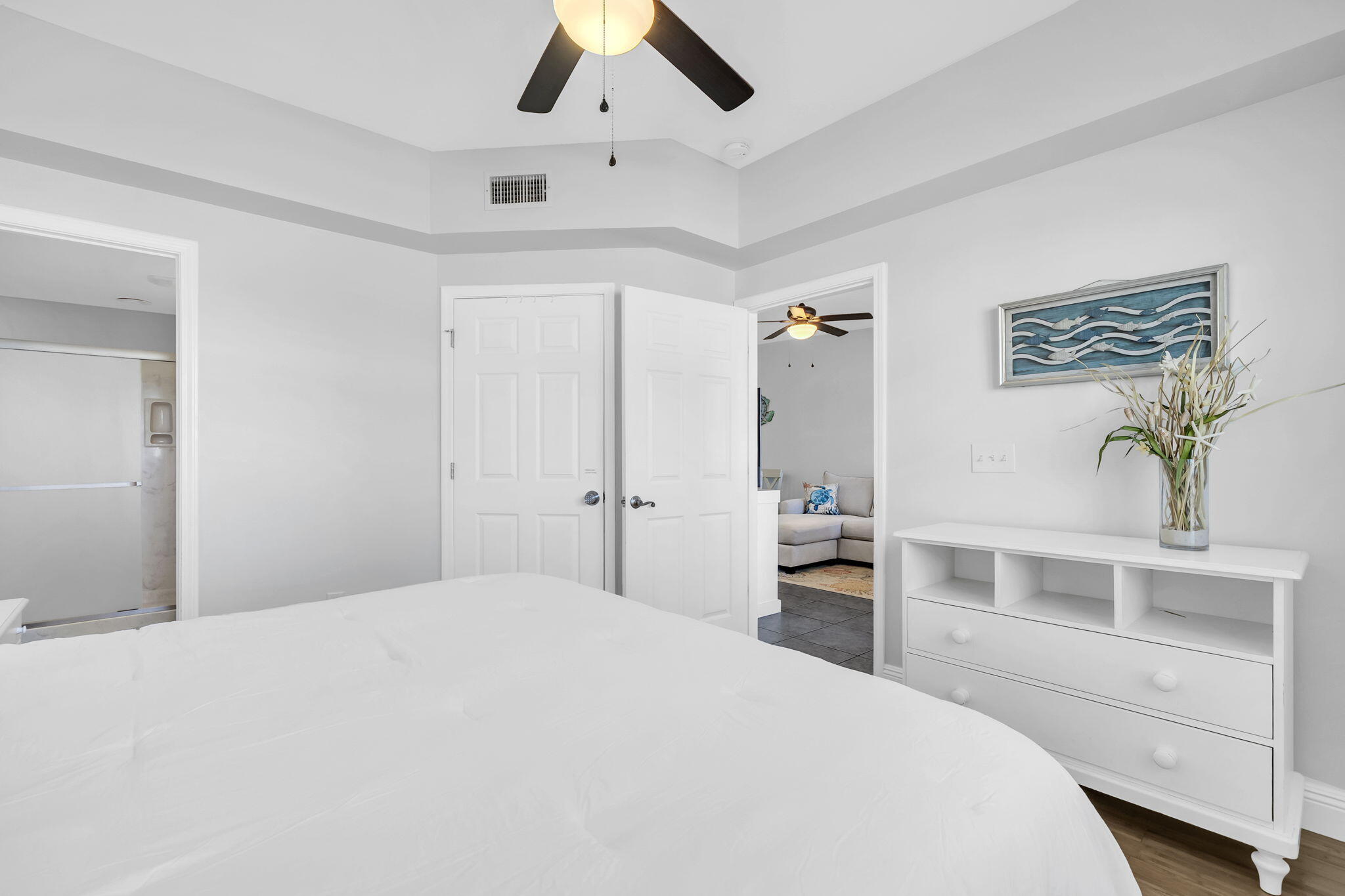 86 Village Boulevard, Unit 411 Santa Rosa Beach, FL 32459 - Photo 12 of 42 a bedroom with a large bed and a desk