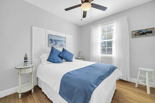 a bedroom with a bed and a window