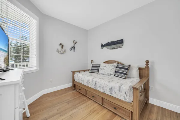 a bedroom with bed and window