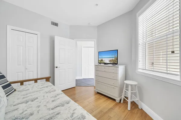 a room with a bed and a window