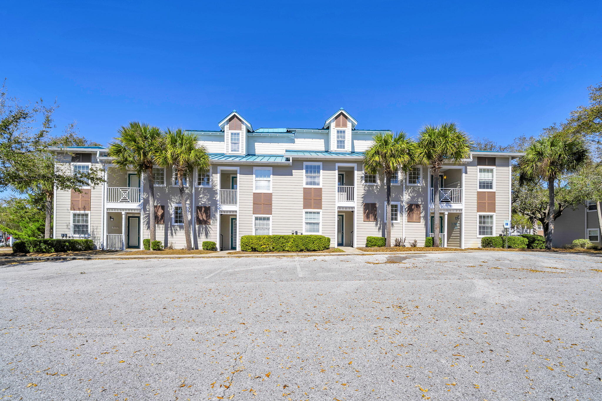 86 Village Boulevard, Unit 411 Santa Rosa Beach, FL 32459 - Photo 21 of 42 a front view of a building with many windows