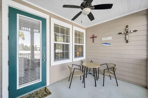 a view of a livingroom with furniture and a ceiling fan
