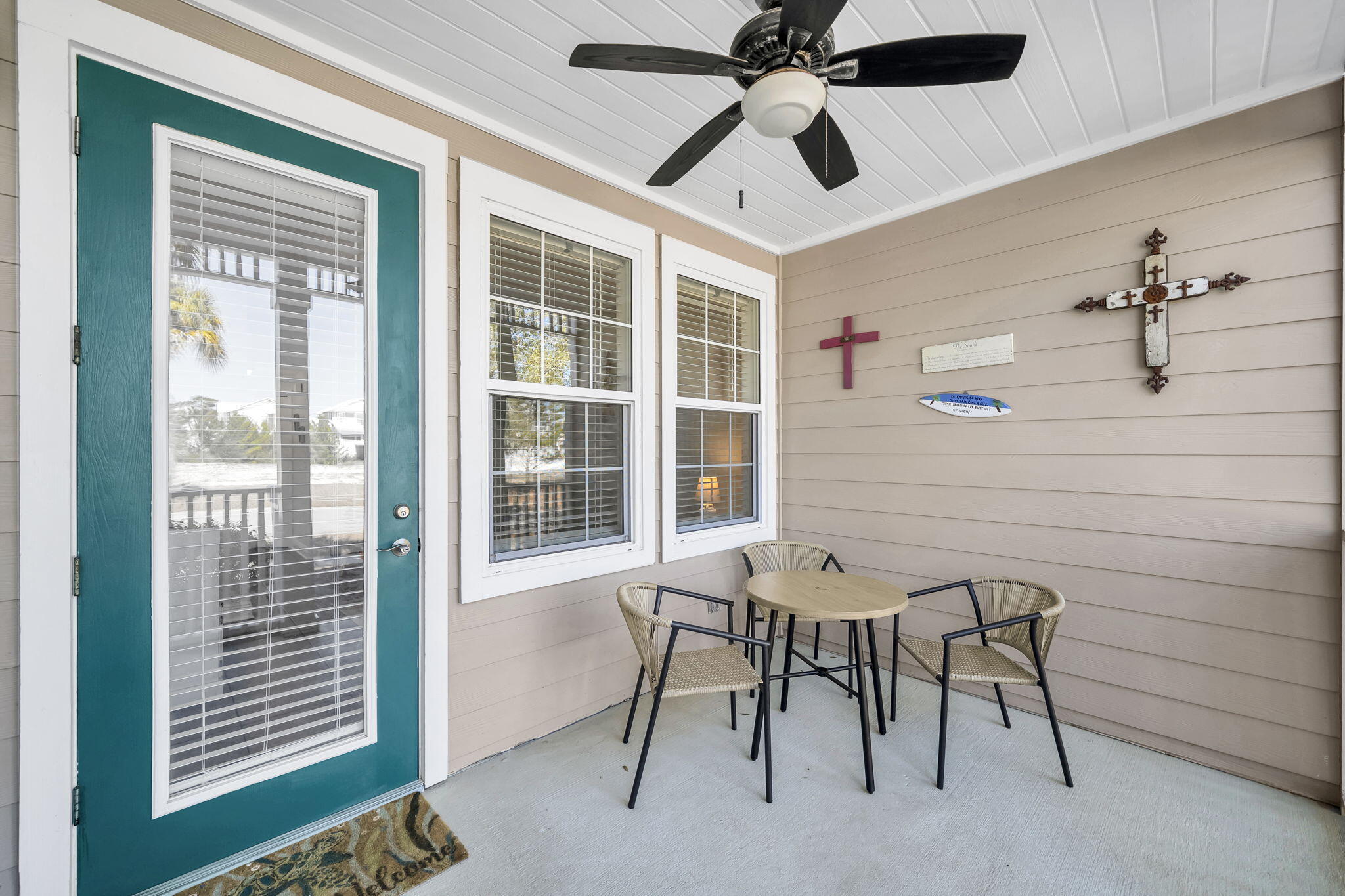 86 Village Boulevard, Unit 411 Santa Rosa Beach, FL 32459 - Photo 22 of 42 a view of a livingroom with furniture and a ceiling fan