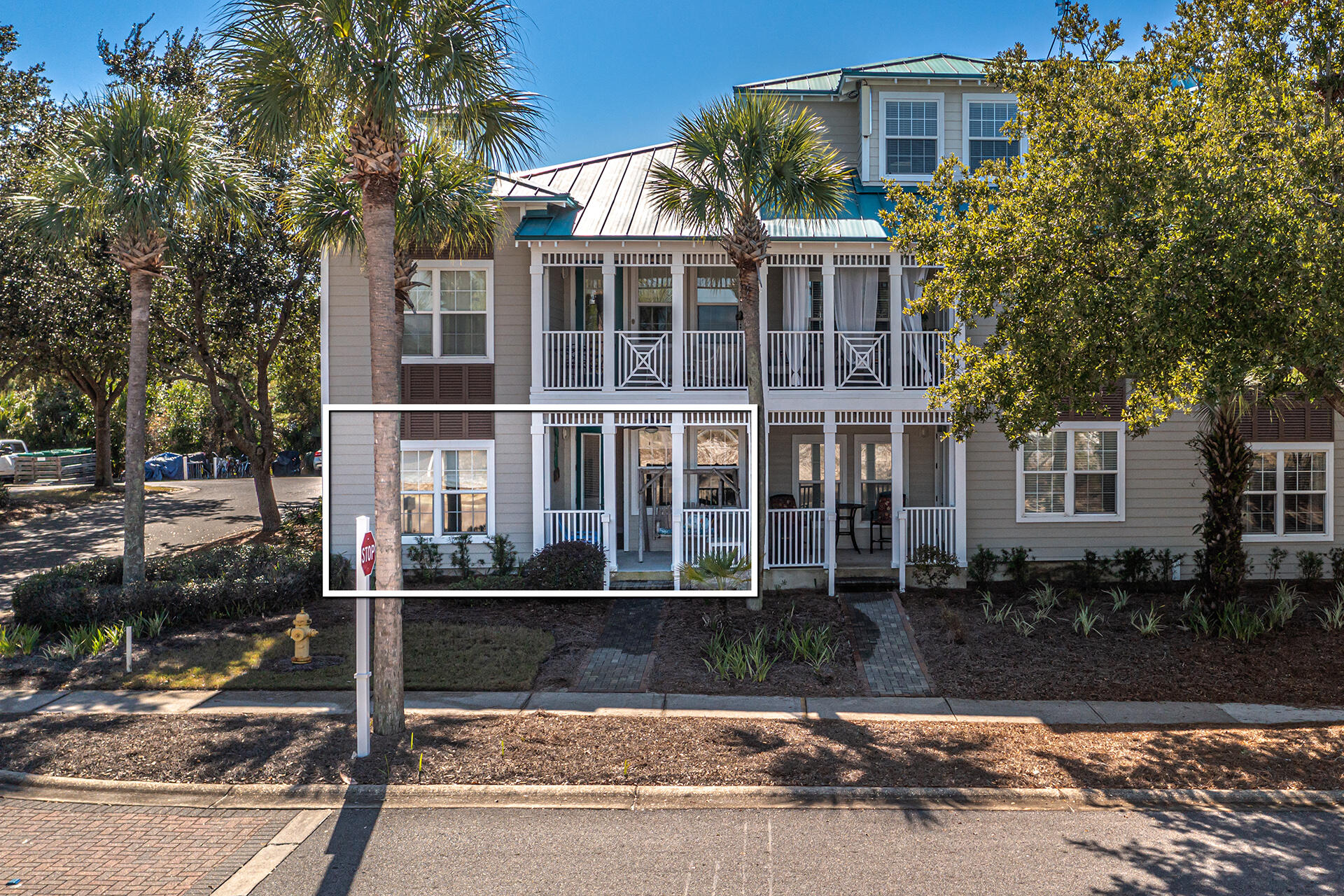 86 Village Boulevard, Unit 411 Santa Rosa Beach, FL 32459 - Photo 24 of 42 a front view of a house with a yard