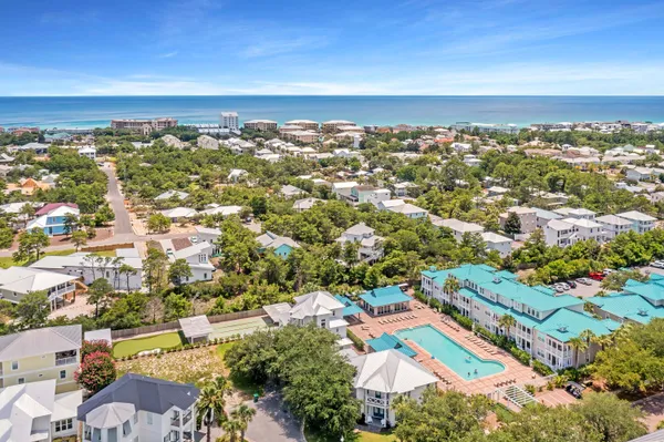 an aerial view of residential houses with outdoor space
