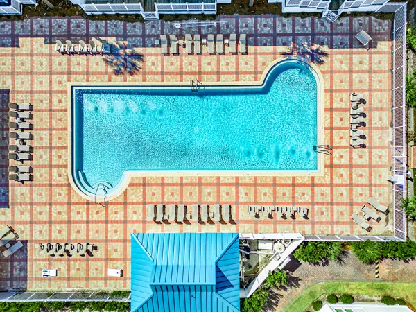 a view of swimming pool with a garden and outdoor seating