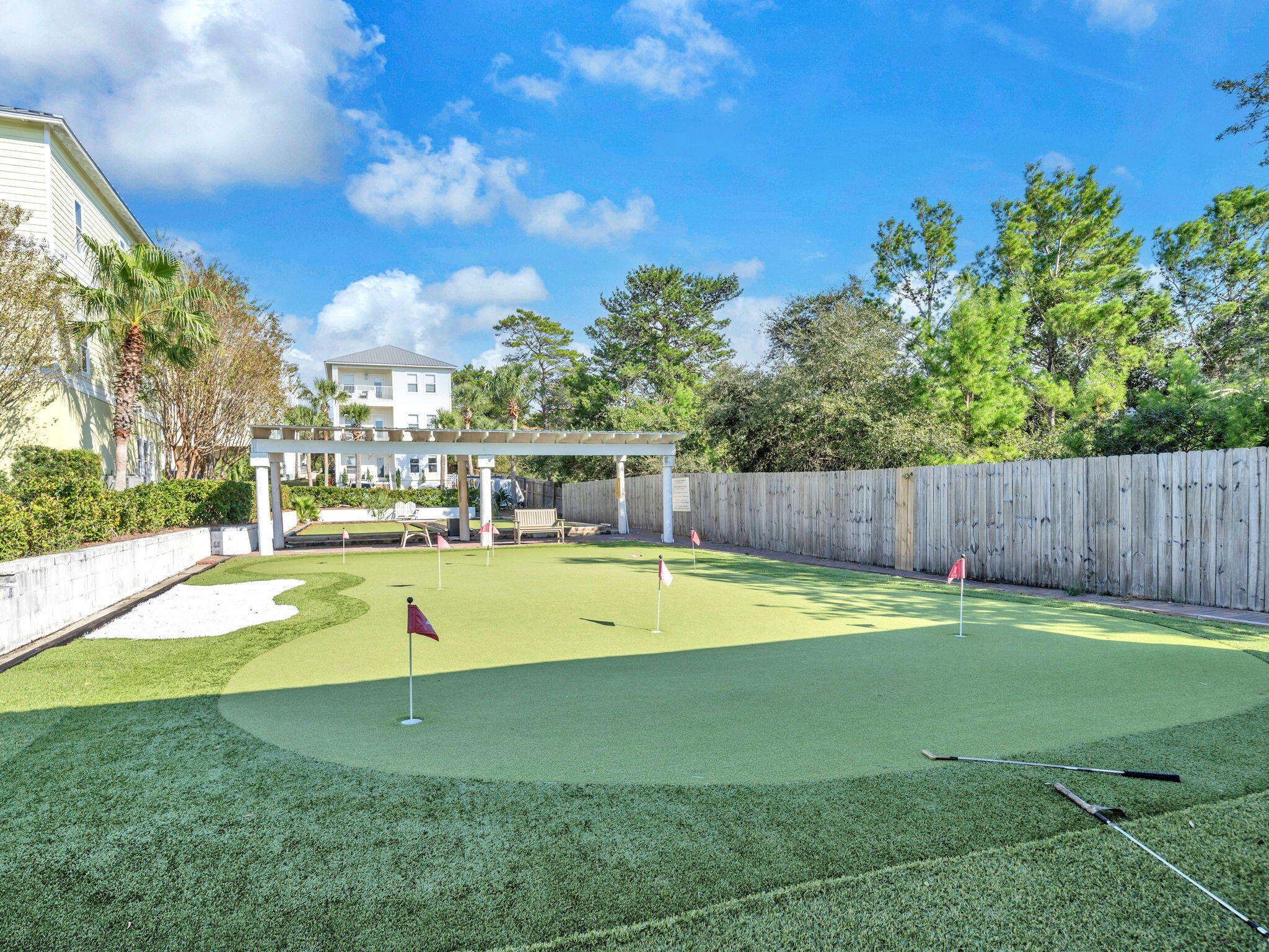86 Village Boulevard, Unit 411 Santa Rosa Beach, FL 32459 - Photo 35 of 42 a swimming pool with wooden fence