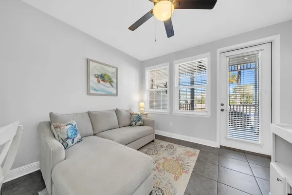a living room with furniture and a window