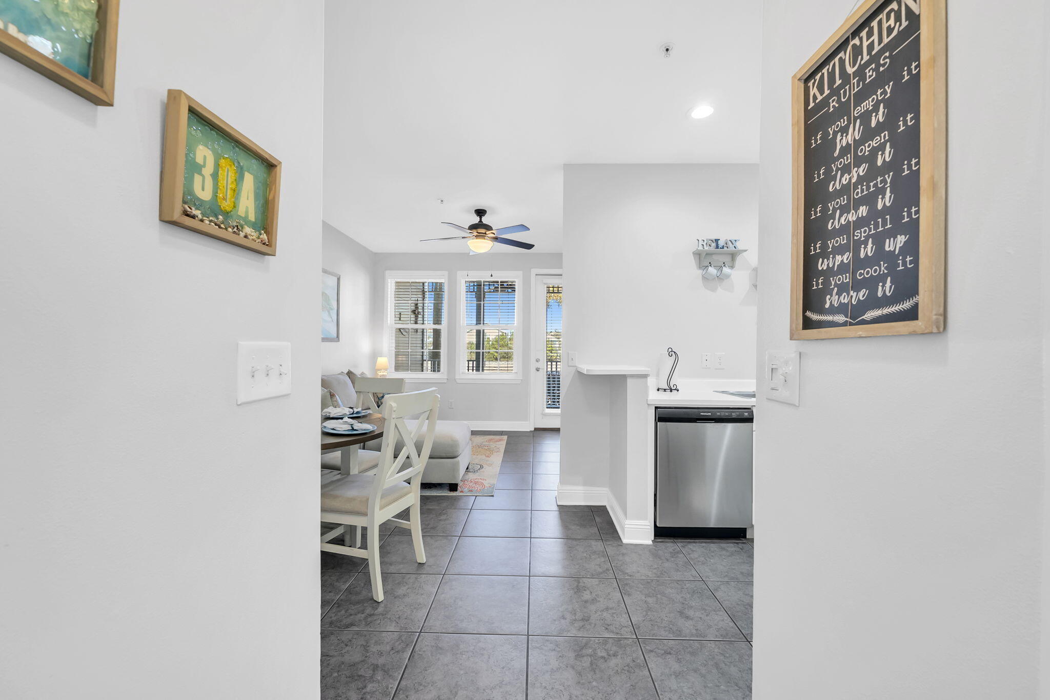 86 Village Boulevard, Unit 411 Santa Rosa Beach, FL 32459 - Photo 9 of 42 a living room with furniture and a painting
