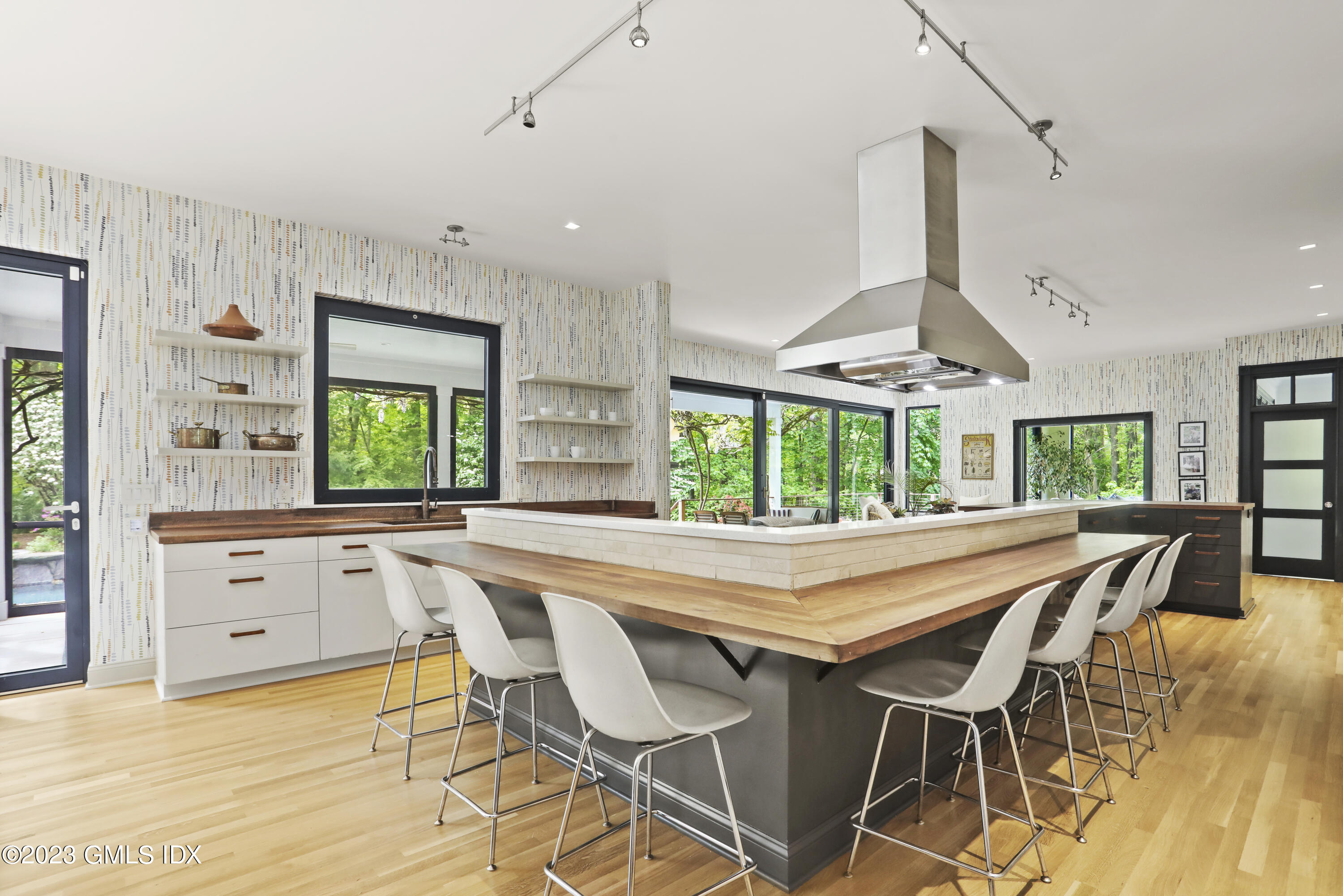 56 Dingletown Road Greenwich, CT 06830 - Photo 12 of 38 a dining area with a sink a counter and chairs