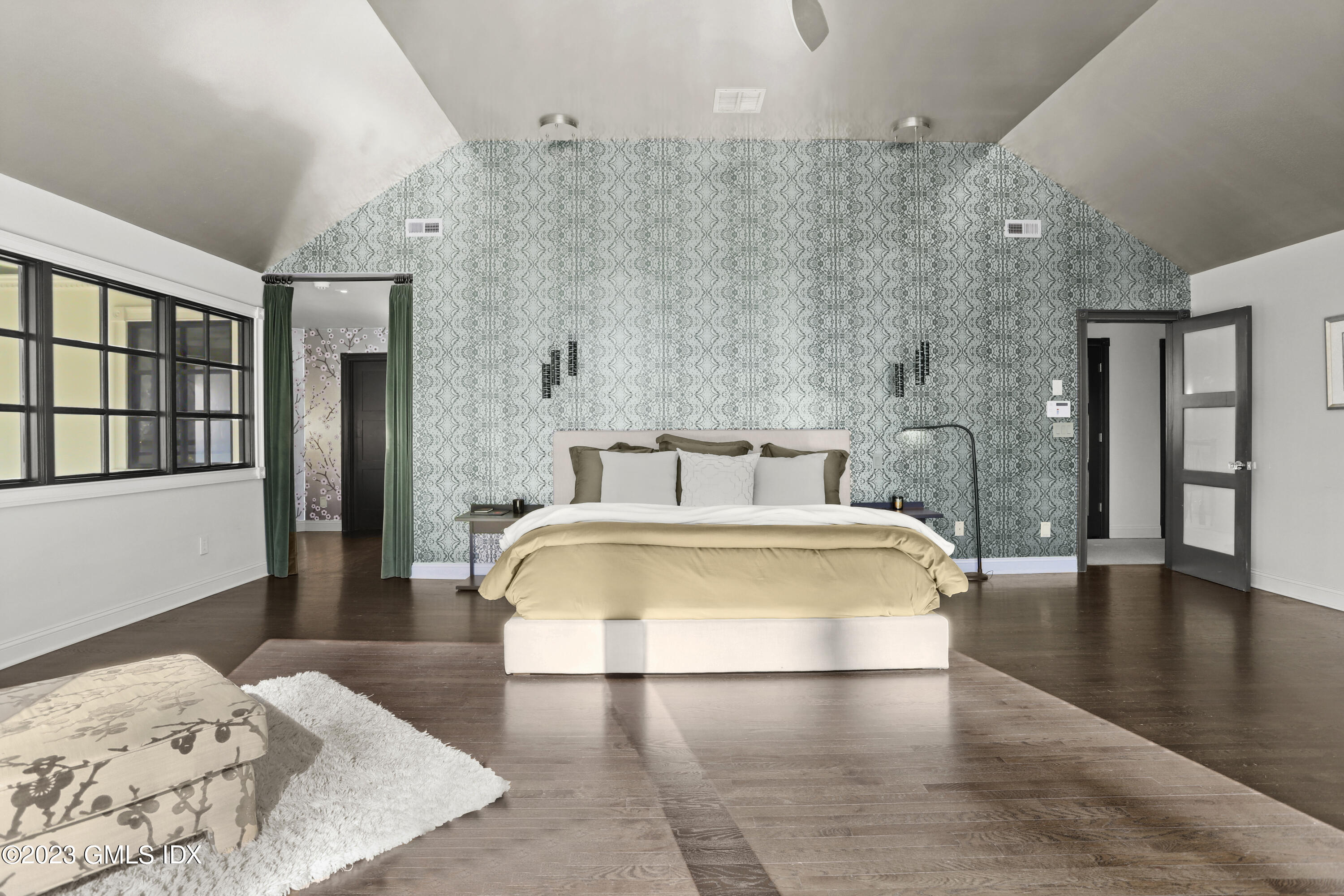 56 Dingletown Road Greenwich, CT 06830 - Photo 22 of 38 a spacious bedroom with a bed and a wooden floor