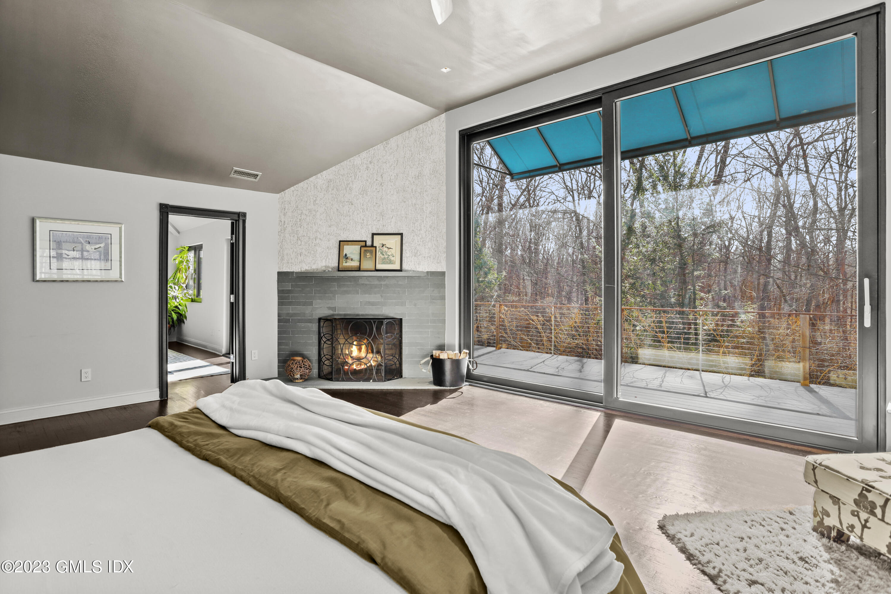 56 Dingletown Road Greenwich, CT 06830 - Photo 23 of 38 a bedroom with a large bed and a large window