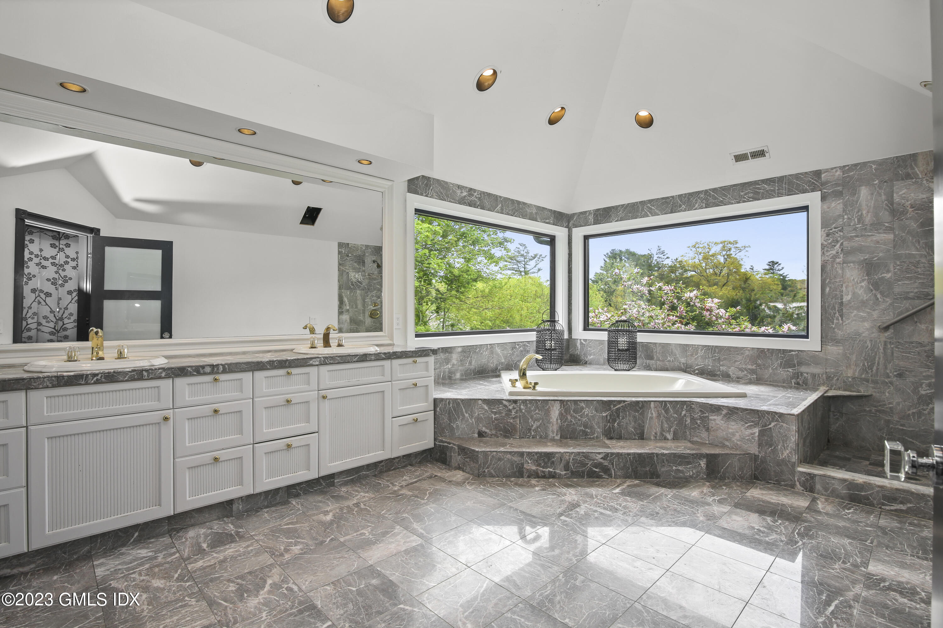 56 Dingletown Road Greenwich, CT 06830 - Photo 25 of 38 a large bathroom with a large tub and sink