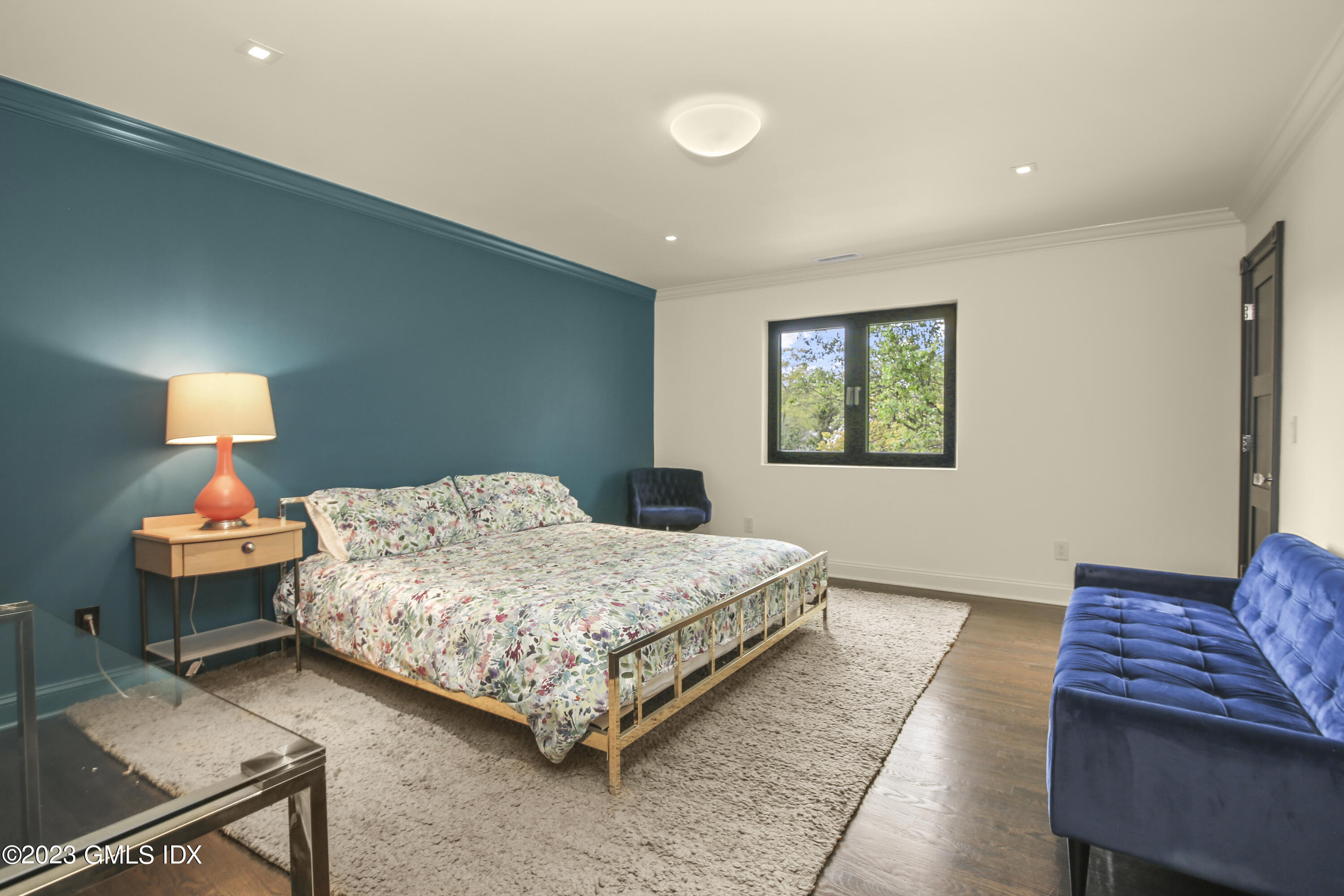 56 Dingletown Road Greenwich, CT 06830 - Photo 29 of 38 a bedroom with a bed and wooden floor