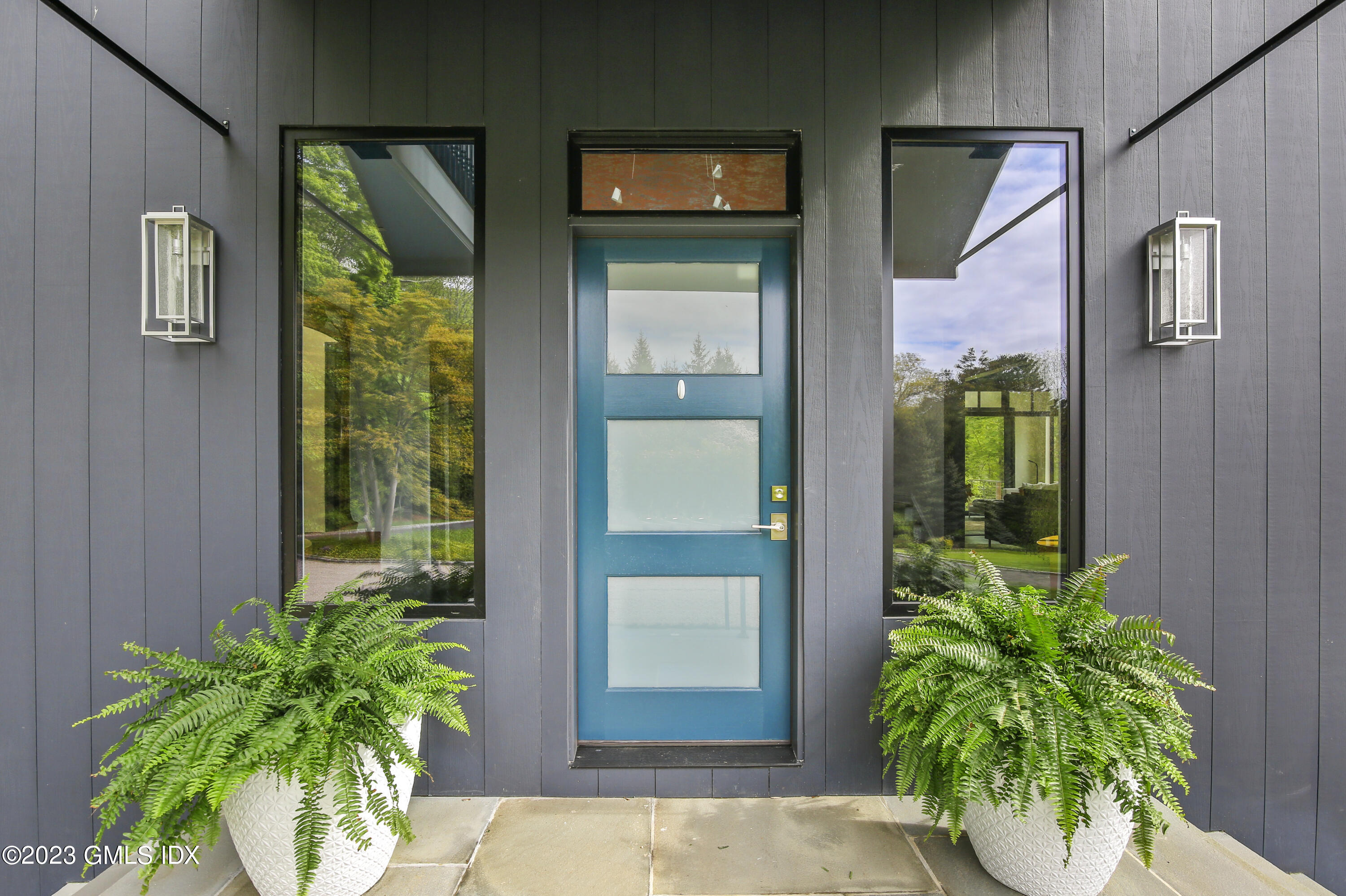 56 Dingletown Road Greenwich, CT 06830 - Photo 3 of 38 a potted plant in front of a door