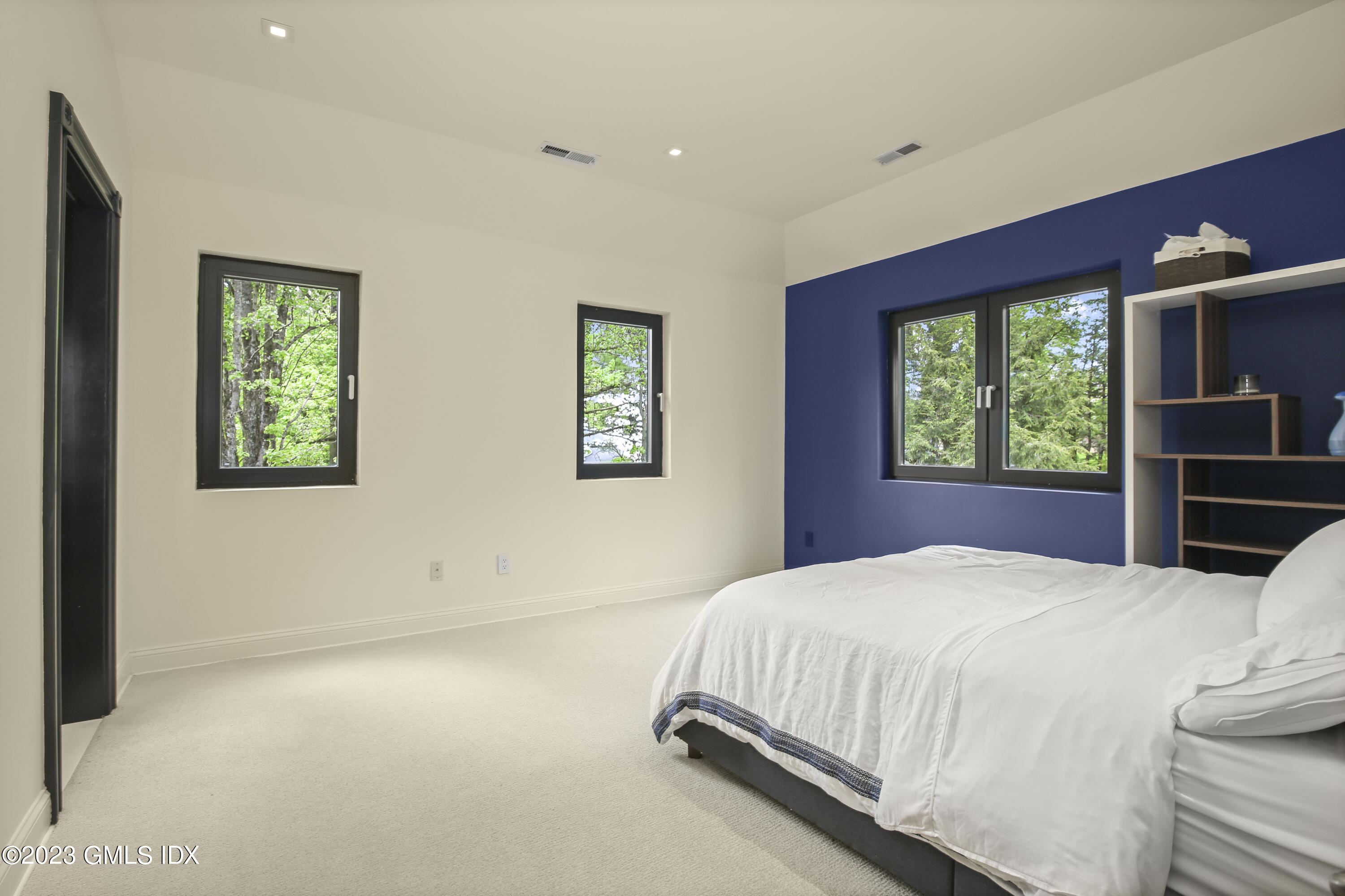 56 Dingletown Road Greenwich, CT 06830 - Photo 33 of 38 a bedroom with a bed and a window