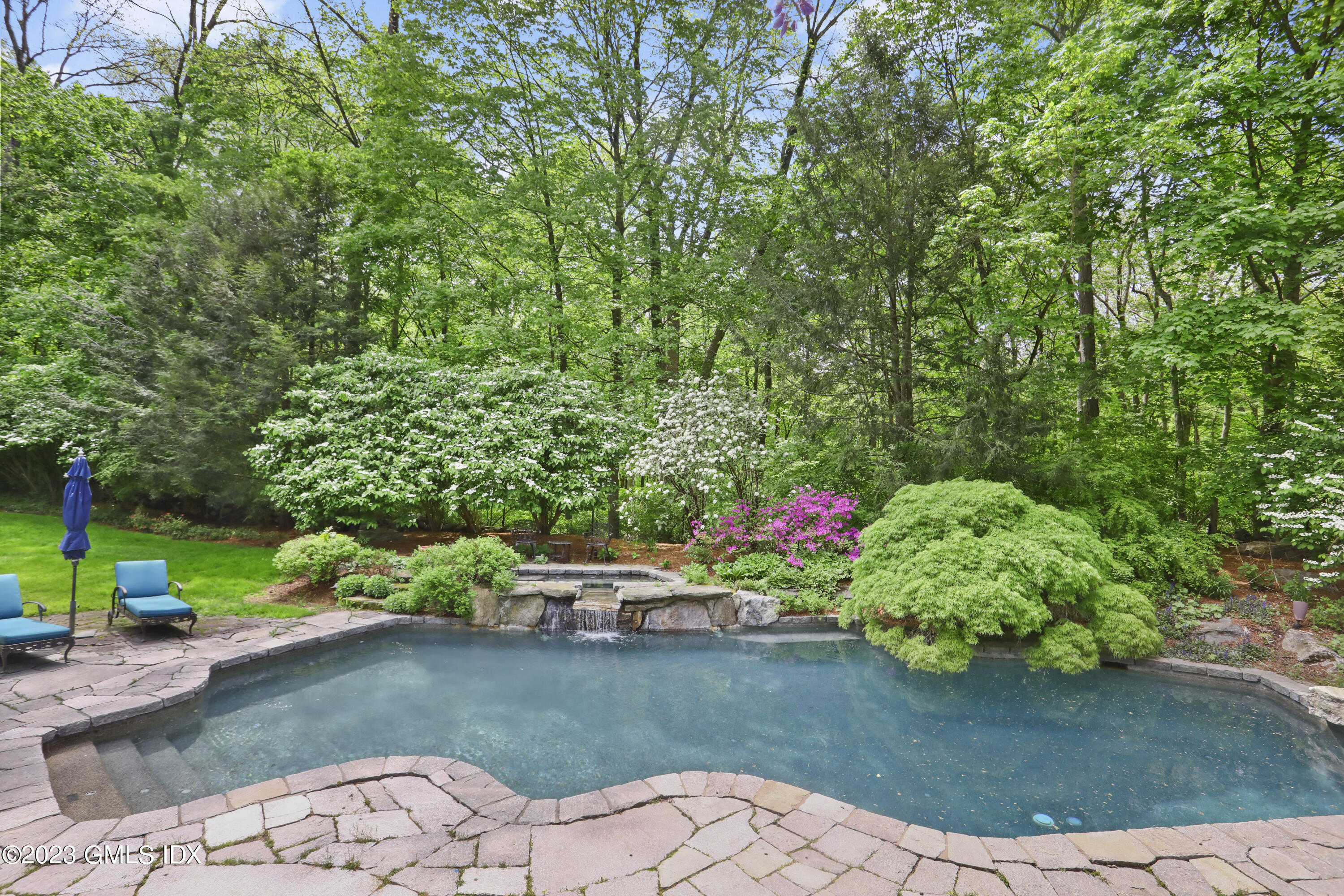 56 Dingletown Road Greenwich, CT 06830 - Photo 38 of 38 a view of a table and chair in the garden