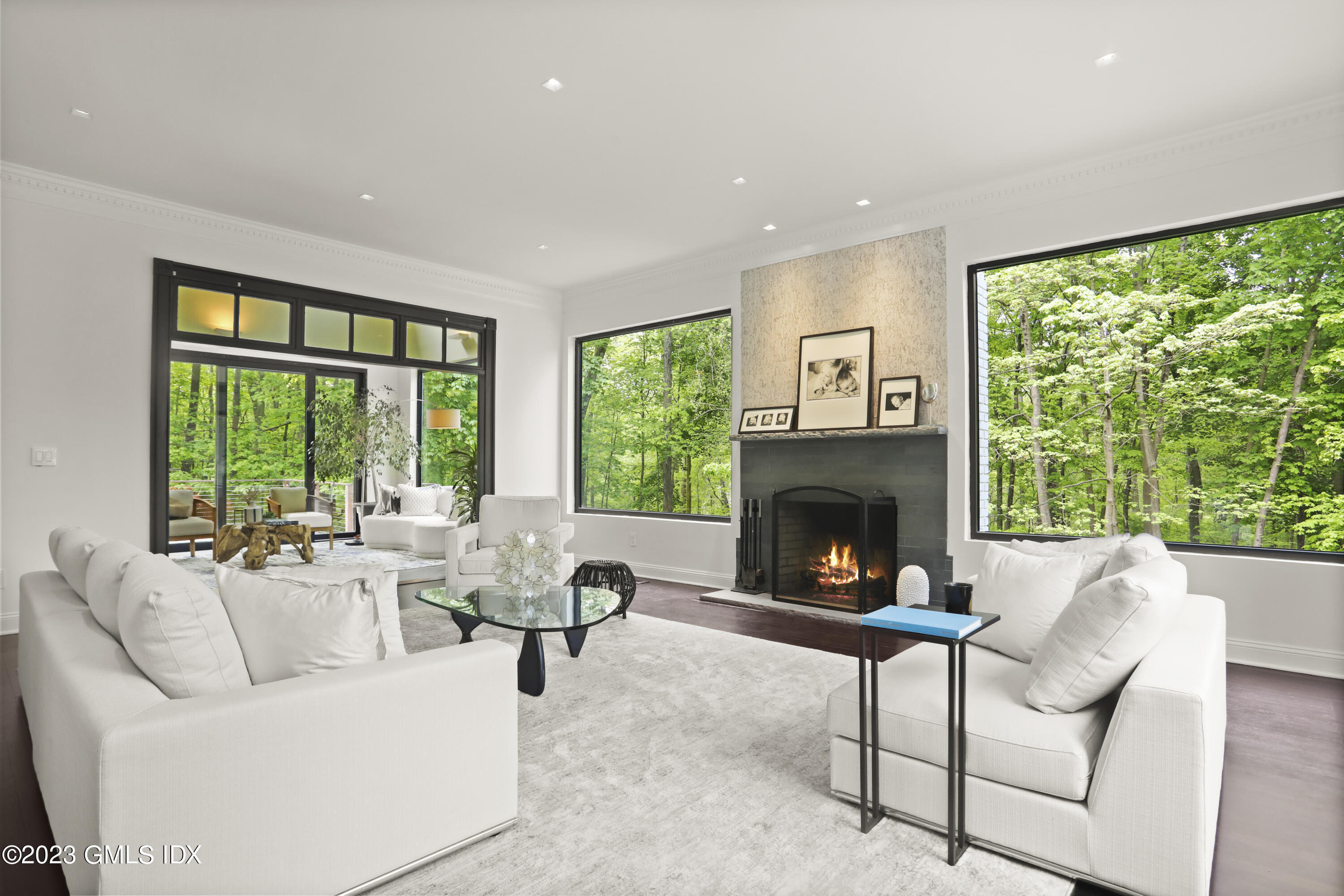 56 Dingletown Road Greenwich, CT 06830 - Photo 5 of 38 a living room with furniture large window and a fireplace