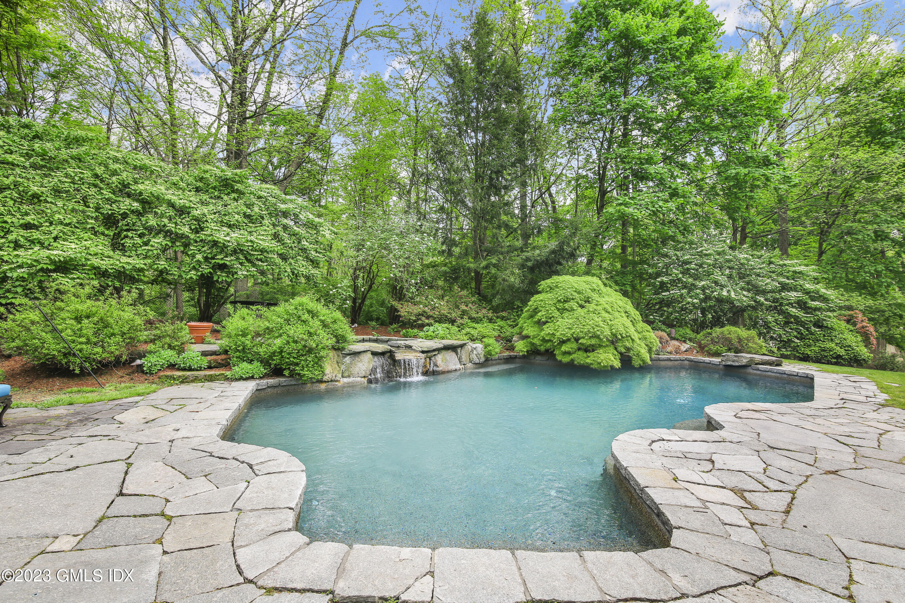 56 Dingletown Road Greenwich, CT 06830 - Photo 9 of 38 a view of a garden with lawn chairs