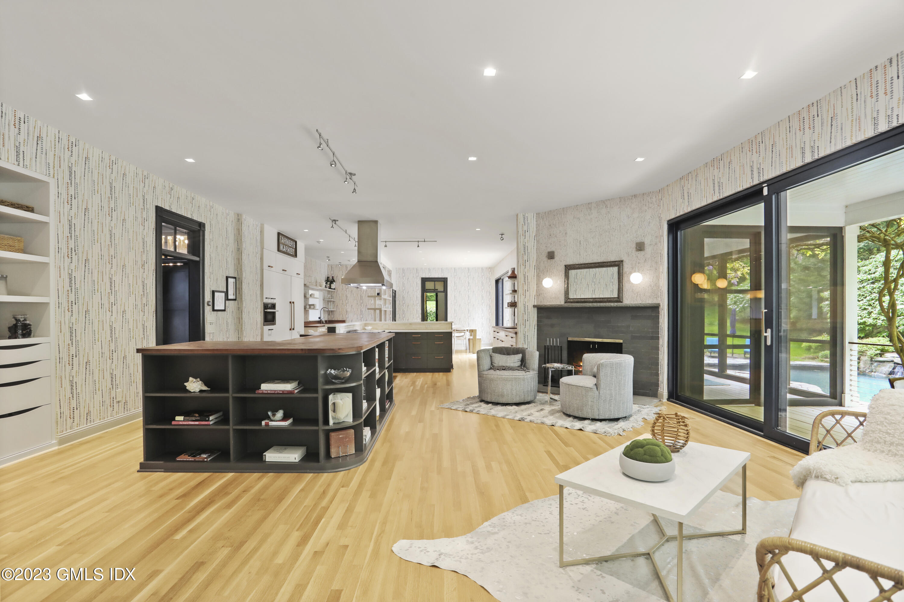 56 Dingletown Road Greenwich, CT 06830 - Photo 10 of 38 a living room with furniture a fireplace and a table