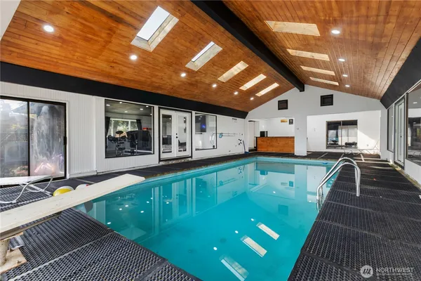 a view of a big dining room with furniture window and wooden floor