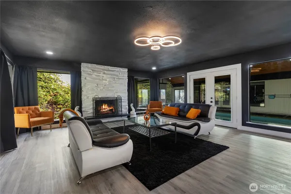 a view of a hallway with entryway wooden floor and front door