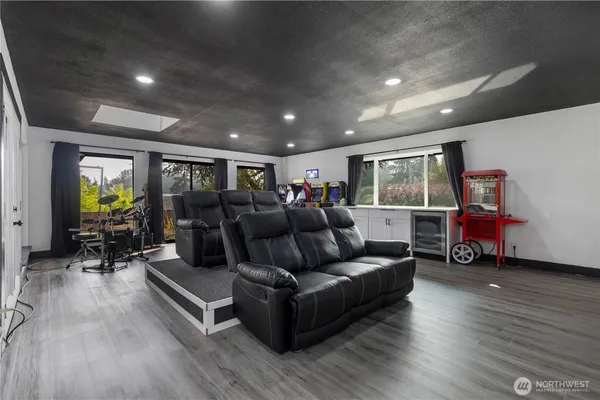 a bathroom with a toilet a sink and a mirror