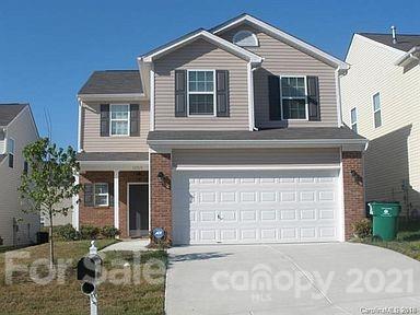 13513 Anne Browers Road Charlotte, NC 28213 - Photo 1 of 1 a front view of a house with a yard and garage