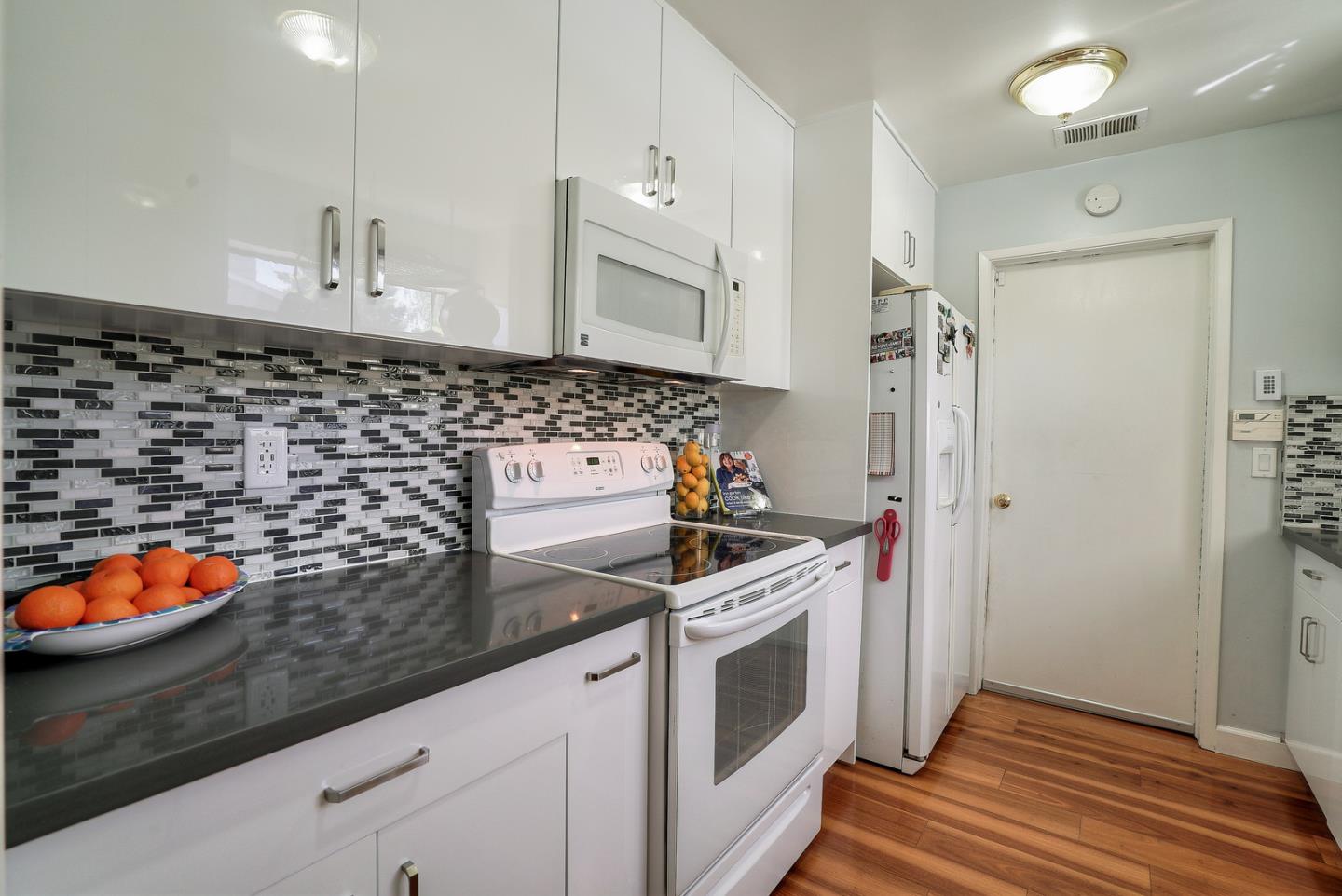 3744 Adriatic Way Santa Clara, CA 95051 - Photo 12 of 34 a kitchen with stainless steel appliances granite countertop a stove and a sink