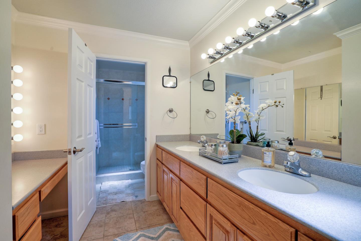 3744 Adriatic Way Santa Clara, CA 95051 - Photo 25 of 34 a spacious bathroom with a granite countertop double vanity sink a mirror and a shower