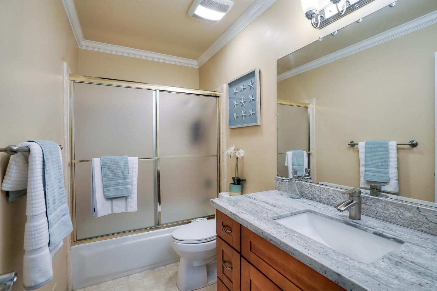 3744 Adriatic Way Santa Clara, CA 95051 - Photo 28 of 34 a bathroom with a granite countertop sink toilet and shower