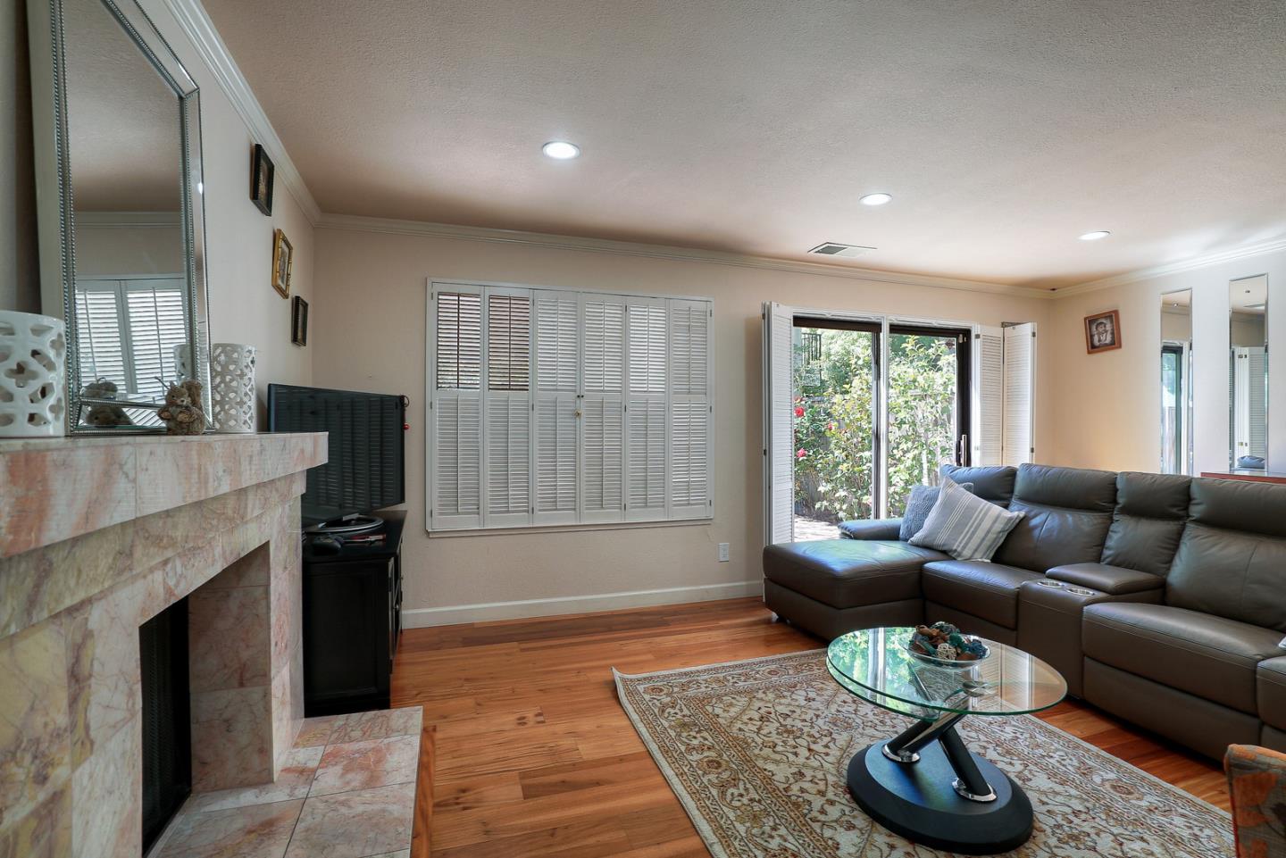 3744 Adriatic Way Santa Clara, CA 95051 - Photo 8 of 34 a living room with furniture and a fireplace
