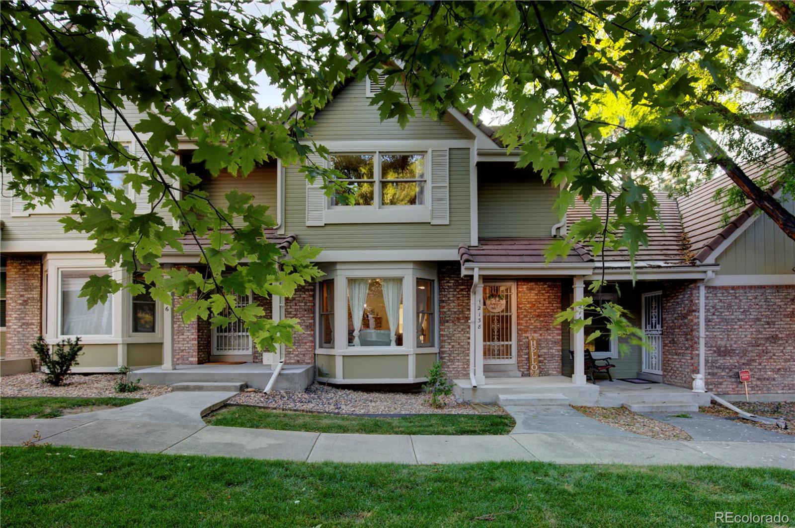 2138 Ranch Drive Westminster, CO 80234 - Photo 1 of 31 a front view of a house with a garden