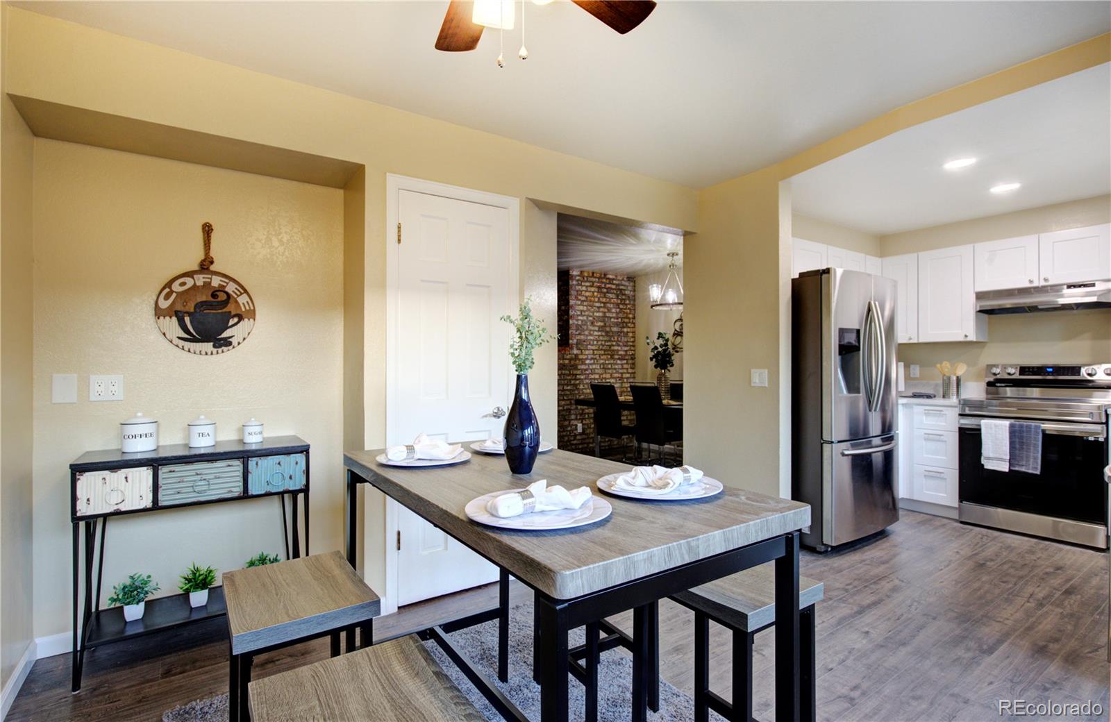 2138 Ranch Drive Westminster, CO 80234 - Photo 12 of 31 a kitchen with a table and chairs in it